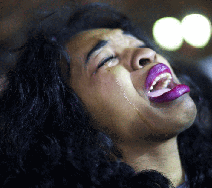 http://worldmeets.us/images/Eric-Garner-aquittal-woman-cries_pic.gif