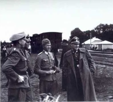 http://www.worldmeets.us/images/nazi.officers.belzec.death.camp_pic.jpg